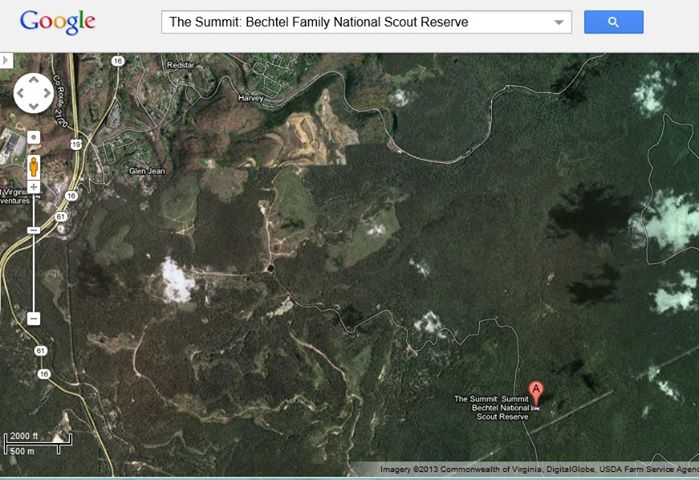 Photo: National Scout Jamboree 2013 disaster threat analysis of new location. The main body will be at the villages that you can see in the center of the picture as two clearings. There are towns to the northwest with the highway. The events are spread across the reserve of mountainous terrain. If there is an emergency near the summit, how are you going to see the people? Look at the tree cover of the new location. Notice they had to draw the road on the map because you cannot see the road from the sky due to tree cover. There is one road up to the summit and down. It is a likely narrow and as you can see curving. It will not be highway quality as in the case of Fort A.P. Hill base. You could not cover that with many emergency vehicles easily even if you had them on hand as you would be able to on a military base. Also if you are the one stuck up on the summit needing help, how do you know you'll have a cell phone signal to call for help? It's clear that you will not have the resources you would at the Fort A.P. Hill base. It's much less secure and unguarded if someone wanted to enter the camp from any direction. The trees would hide them on their way in and out. I'm going to show you a picture of the interactive map of the event so you get a feel for the terrain and how spread out the activities are.